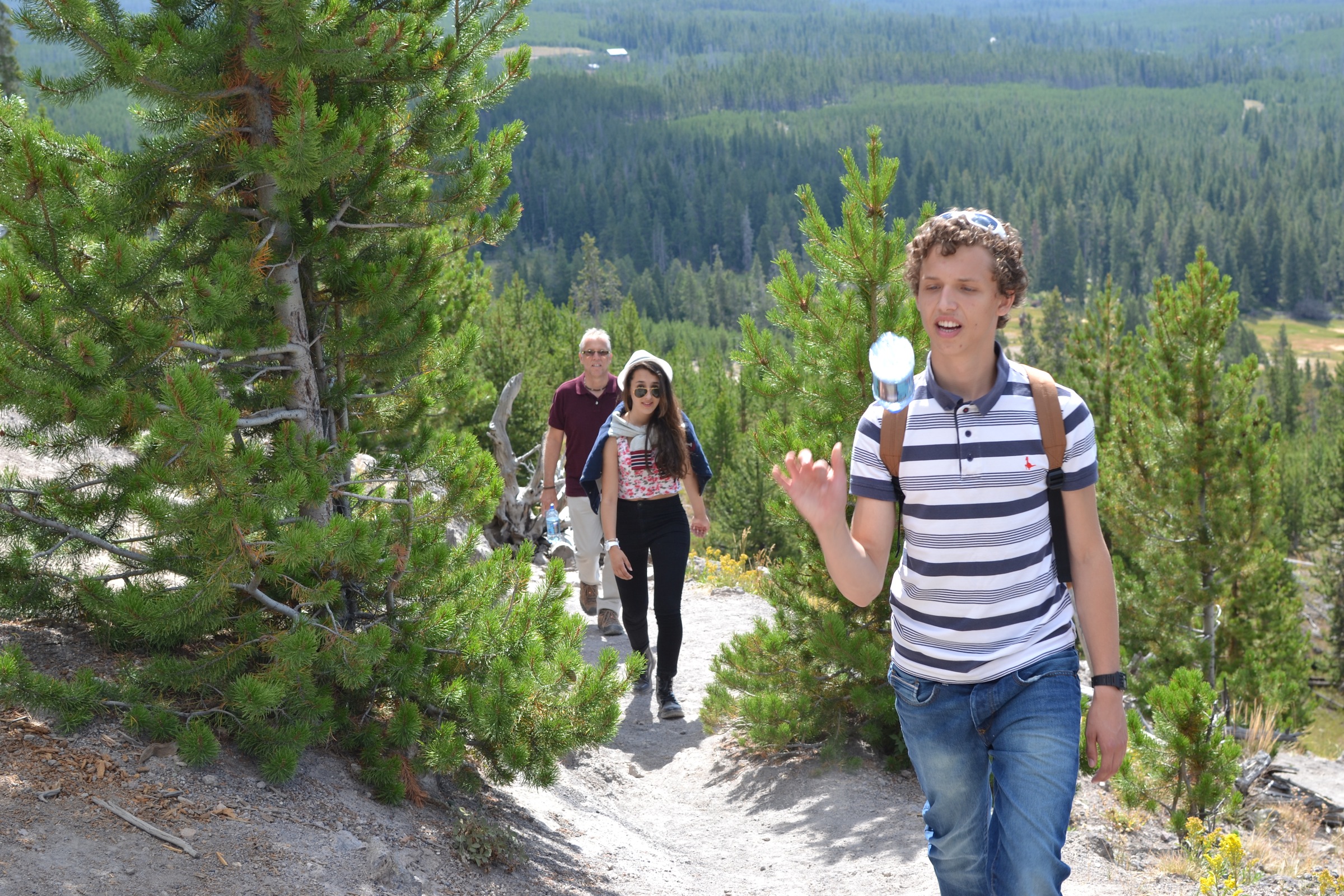 Action shot, walking and throwing a bottle